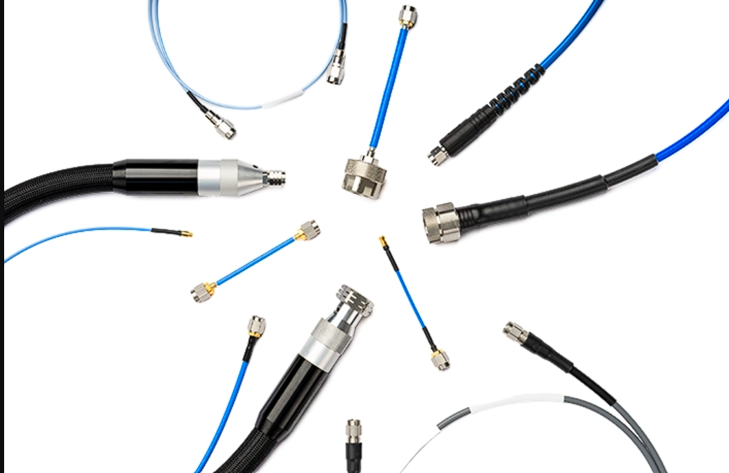 Collection of various cables and connectors on a white background