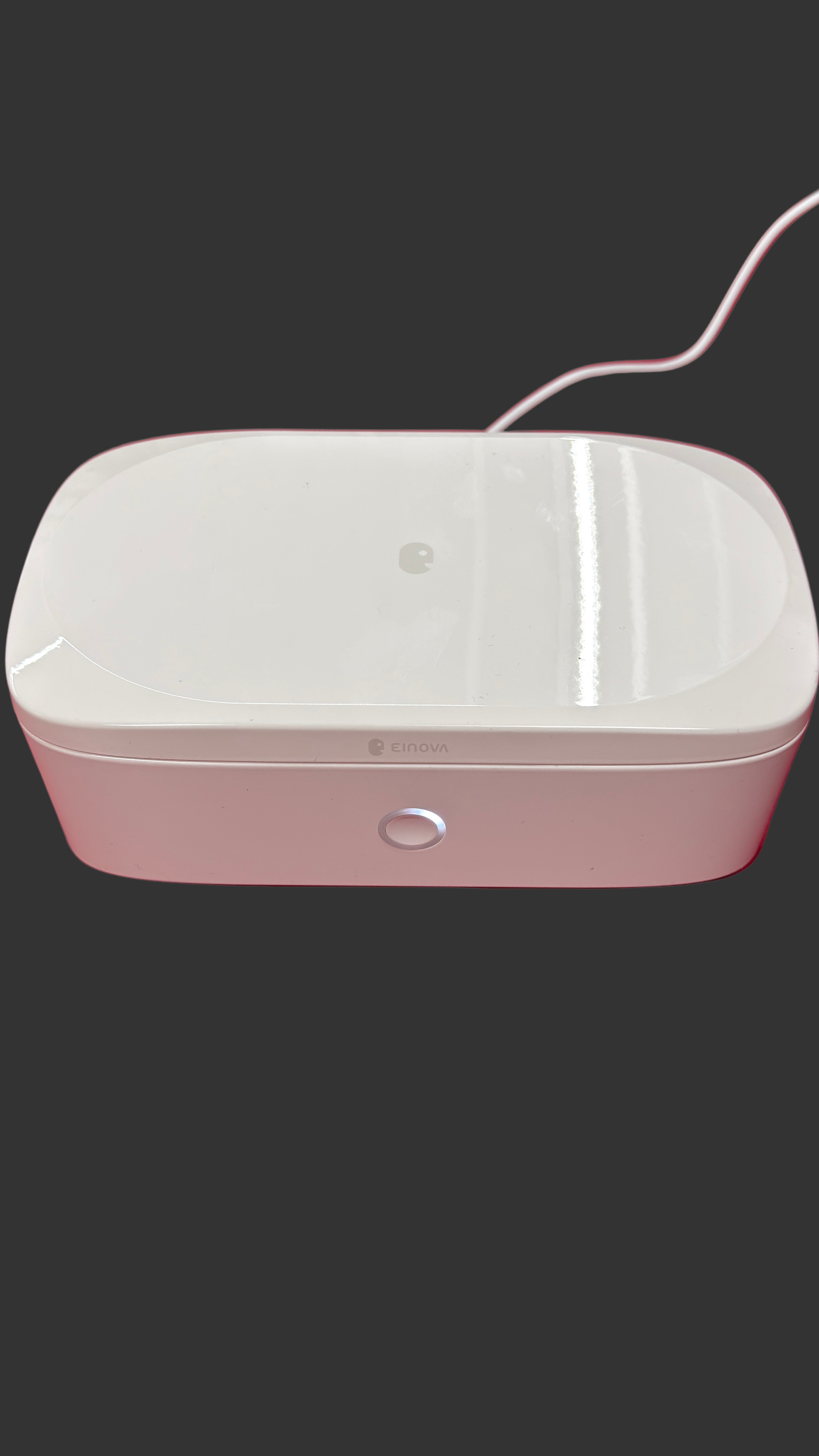 White electronic device on a red surface