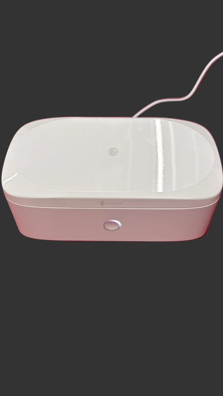 White electronic device on a red surface